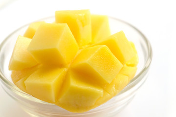 Yellow mango fruit on a white background