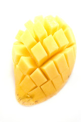 Yellow mango fruit on a white background