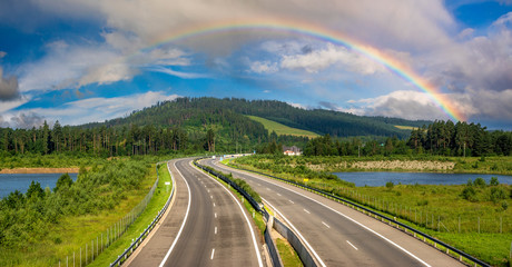 Rainbow over the highway in the mountains