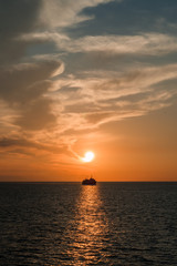 Naklejka na ściany i meble sunset on the sea, view from the ship
