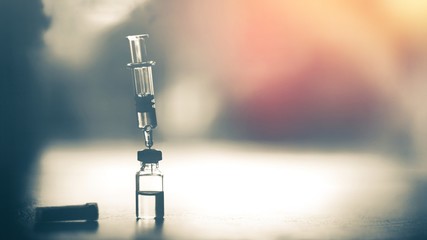 Vaccine vial dose flu shot drug needle syringe,medical concept vaccination hypodermic injection...