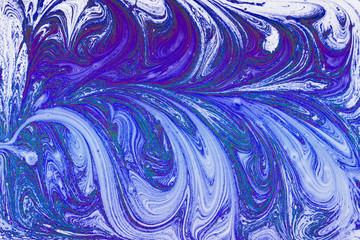 Texture of liquid paint. Abstract background mixed with blue and white paint.