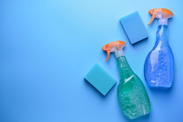 Set of cleaning supplies on color background