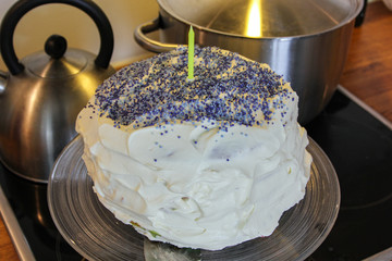 Cream brithday cake on the kitchen top