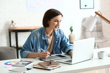 Female designer working in office