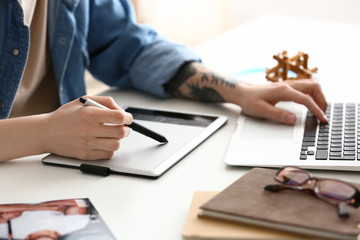 Female designer working in office, closeup