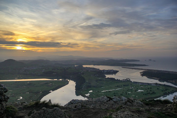 Dramatic sunset above the meander of the river