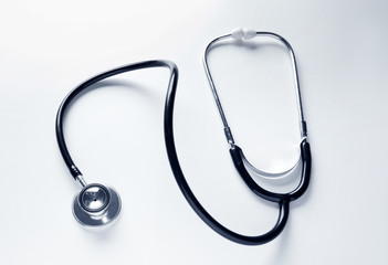 Medical stethoscope on white background