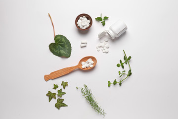 Obraz na płótnie Canvas Composition with plant based pills on white background