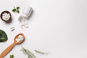 Fototapeta na wymiar Composition with plant based pills on white background