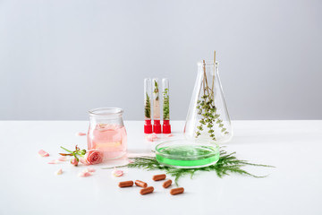Obraz na płótnie Canvas Composition with plant based pills on table