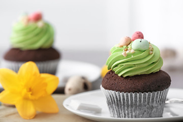 Sweet Easter cupcake on table