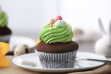 Sweet Easter cupcake on table