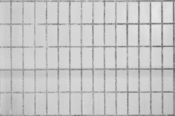 Background from dirty gray rectangular ceramic tiles