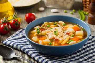 Minestrone soup with pasta and cheese.