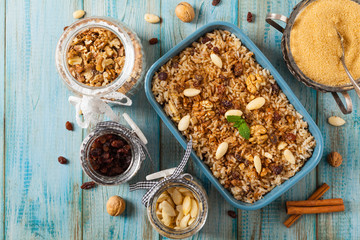 Traditional, mexican baked sweet rice, with almonds, raisins and walnuts.