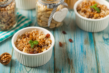 Traditional, mexican baked sweet rice, with almonds, raisins and walnuts.