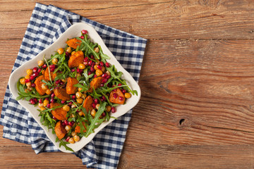 Sweet potato salad with lentils, pomegranates and rocket.