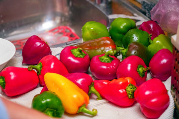 Bell peppers on a white towel in the kitchen