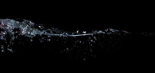 water waves splash and bubbles isolated on black background