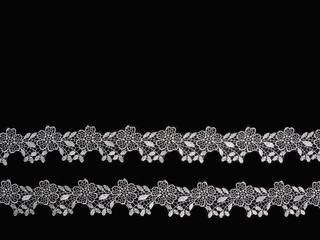 White lace on a black background