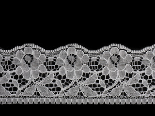 White lace on a black background
