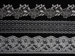 White lace on a black background