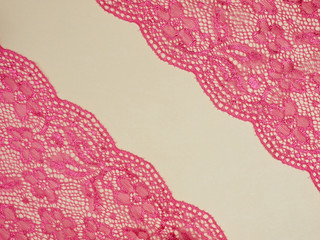 Red lace on a beige background
