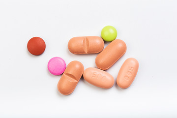 set of multi-colored tablets  on a white background