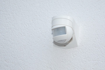 white detector for security system motion sensor on wall