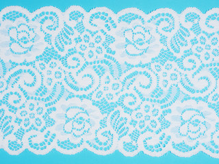 Wide white lace on a blue background