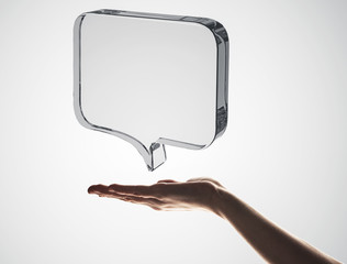 Concept of communication by glass empty chat icon on gray background