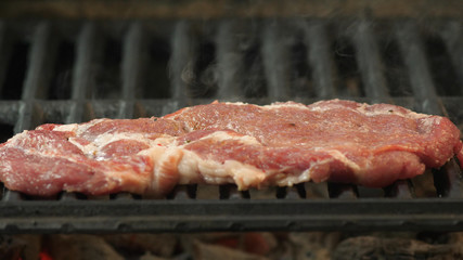 Barbecue beef steak on grill close up