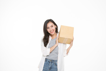 Delivery, relocation and unpacking. Smiling young woman holding cardboard box isolated on white background