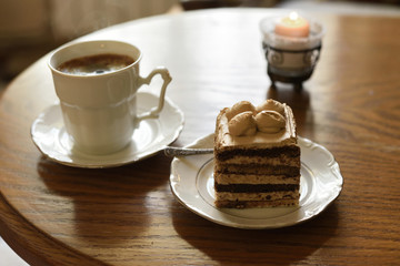 Cafe table with coffee and cake