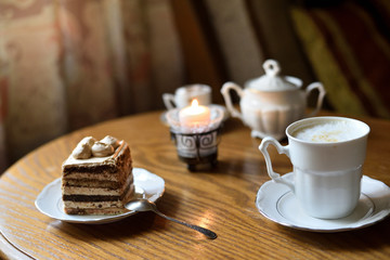 Set coffee table with coffee cake candle and sugar-bowl