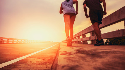 Two runners ran outside. And running on jogging roads. The concept of creating good health