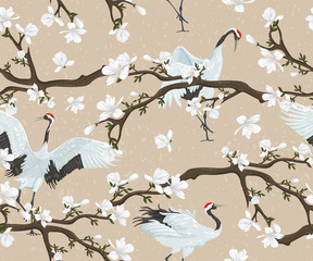 Modèle sans couture avec grues japonaises et magnolia en fleurs