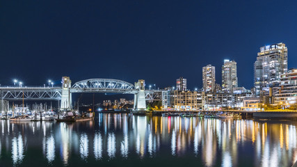 Fototapeta na wymiar Vancouver, British Columbia, Canada. Burrard Bridge, as it spans across False Creek.