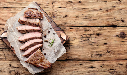 Beef steak on a wooden background