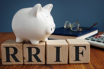 Registered retirement income fund RRIF from wooden cubes.