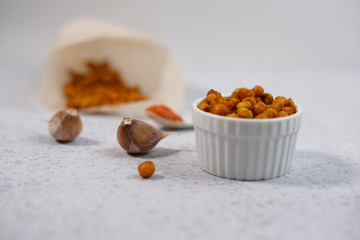 Vegan healthy snack,spicy roasted chickpeas in bowl. Selective focus, space for text.