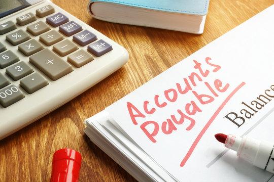 Accounts payable handwritten by marker on balance sheet.