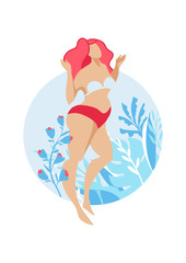 The girl with bright hair and a beautiful swimsuit posing on a background of flowers. Body positive concept