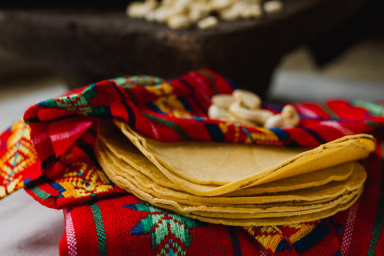 Close-up of corn tortillas on a mexican tortillero. Colorful Mexico food