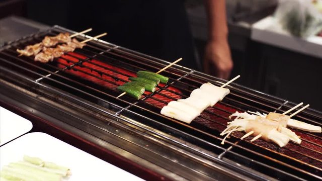 Tasty thai grilled seafood in food court: vegetables, fish, squid