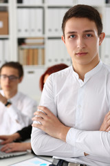 Beautiful smiling business man at workplace