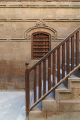 Wooden window and staircase with wooden balustrade leading to historic Beit El Set Waseela building (Waseela Hanem House), Old Cairo, Egypt