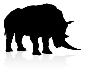 Obraz na płótnie Canvas A rhino or rhinoceros safari animal silhouette