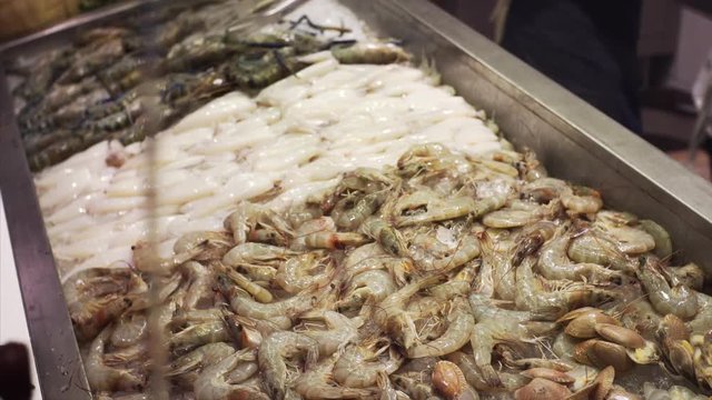 Big row shrimps on ice in Bangkok food court, Thailand